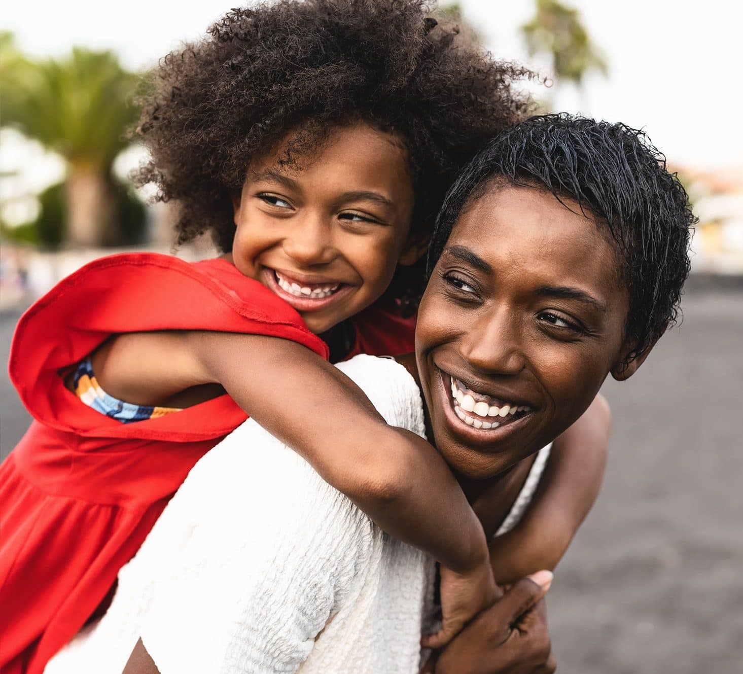 happy-african-family-having-fun-on-the-beach-during-summer-holidays-e1657706530227.jpg